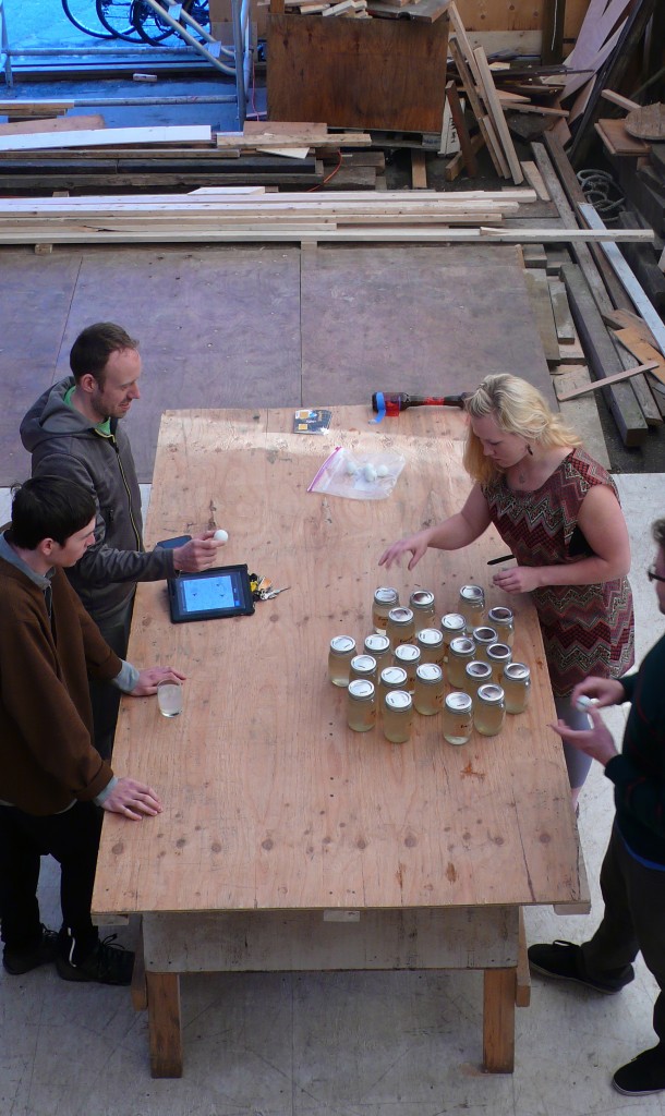 Preparing bottles for delivery, in the Bomford Studios